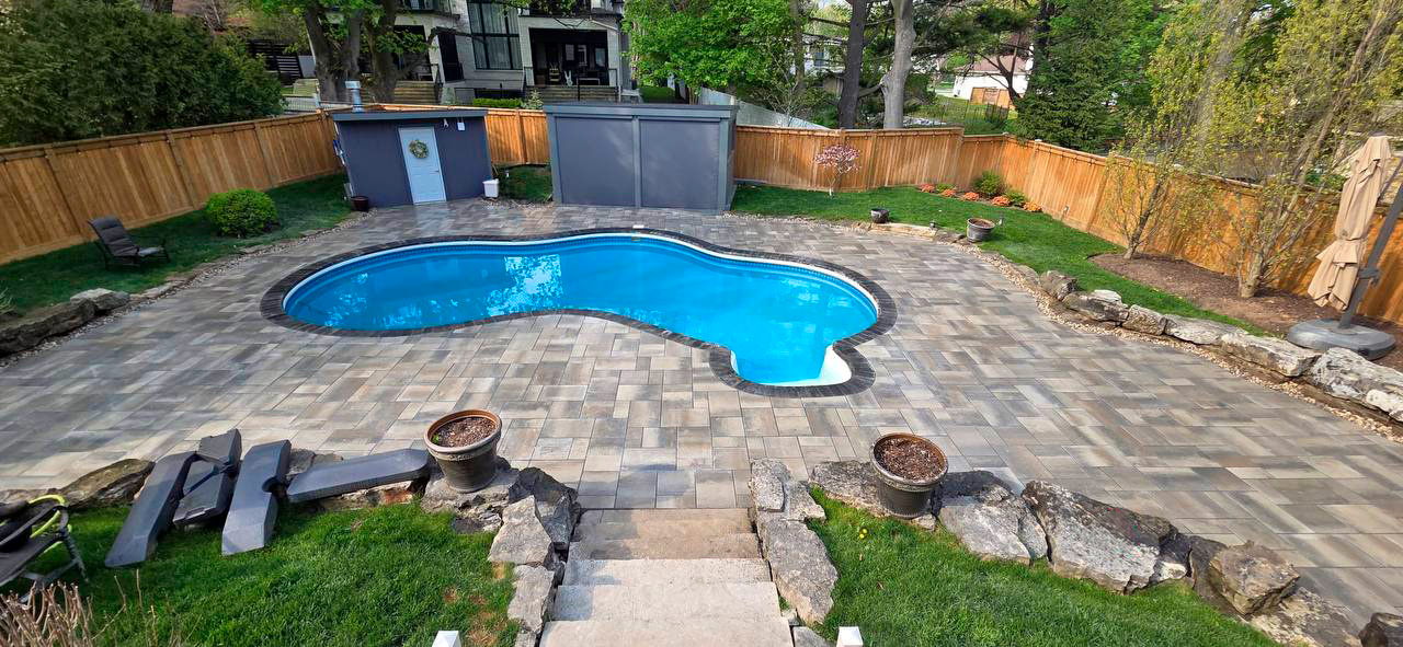 Finished outdoor pool patio paver installation in Toronto